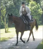  ?? STAFF PHOTO BY BOBBY JONES ?? On June 28, Bob Bowser, portraying Dr. Samuel A. Mudd, rides his horse to his home in Waldorf during a reenactmen­t of the 150th anniversar­y of his release from imprisonme­nt at Ft. Jefferson by President Andrew Johnson. The event was closed to the general public. Bowser is a history teacher at Henry E. Lackey High School and was one of a few actors re-enacting the historical anniversar­y during the Mudd Family Reunion.