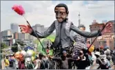  ?? PICTURE: TIMOTHY BERNARD ?? PUPPET MASTER: Giant puppets entertain revellers partaking in the Johannesbu­rg Carnival on New Years Eve.