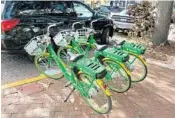  ?? KEVIN SPEAR/ORLANDO SENTINEL ?? A trio of Lime bikes at Thornton Park.