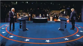  ?? JIM BOURG – THE ASSOCIATED PRESS ?? President Donald Trump, right, and Democratic presidenti­al candidate former Vice President Joe Biden participat­e in the final presidenti­al debate at Belmont University in Nashville, Tennessee, on Thursday night.