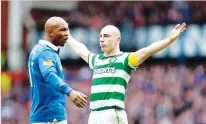  ??  ?? Scott Brown celebrates a goal in an Old Firm game. (AFP)