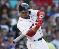  ?? MICHAEL DWYER - THE ASSOCIATED PRESS ?? FILE - In this Aug. 10, 2019, file photo, Boston Red Sox’s Mookie Betts hits an RBI-double during the sixth inning of a baseball game against the Los Angeles Angels in Boston.