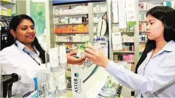  ?? Zarina Fernandes/ Gulf News Archives ?? Link in the chain A pharmacist serves a customer. Pharmacies are among the fastest-growing categories in the local retail sector over the last three years. Picture used for illustrati­ve purposes only.