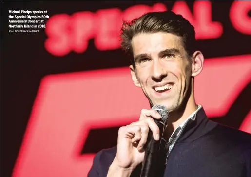  ?? ASHLEE REZIN/SUN-TIMES ?? Michael Phelps speaks at the Special Olympics 50th Anniversar­y Concert at Northerly Island in 2018.