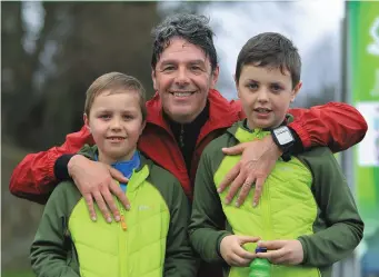  ?? By Valerie O’Sullivan. ?? Davide Mosco, greeted by his sons Marco and Luca, after competing in the 10Km Park Run in Killarney National Park, hosted by Hardman events, in aid of Killarney Micro track, part of the Killarney Mountain Festival at the weekend.Photo