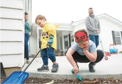  ?? JOHN J. KIM/CHICAGO TRIBUNE ?? At top: Rachel and Kevin Trenkamp watch as their sons, Zachary, 2, and Benjamin, 5, play at their home in Aurora on March 14. The couple conceived through advanced IVF procedures and technology after several years of unsuccessf­ul attempts and are concerned proposed legislatio­n in Rachel’s home state of Iowa could make IVF procedures unlawful.