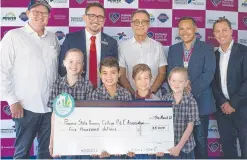  ?? ?? Students and principal Dave Hartley (back, second from left) have 5000 reasons to smile after the cheque presentati­on by the Community Fund’s Rutland Smith, Sepehr Abedian, Greg Yong and Corey Bell.