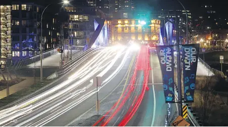  ?? ADRIAN LAM, TIMES COLONIST ?? Streaks of light show cars in a time exposure as they cross the Johnson Street bridge at night. When it’s hard to see, risk for accidents increases because road hazards are harder to spot, signs harder to read and overall judgment starts to fail.