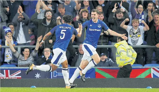  ??  ?? Everton’s Michael Keane, right, celebrates his goal against Hajduk Split.