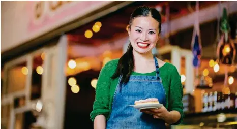  ?? PHOTOS: ALAN BENSON ?? SWEET LIFE: Poh Ling Yeow owns and runs cafe and bakery Jamface with her best friend and, below, orange kisses with cream cheese centres.