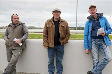  ??  ?? Michael O’Rourke, Lotty Murphy and Johnny Kavanagh enjoying a night at the dogs at Enniscorth­y Greyhound track.