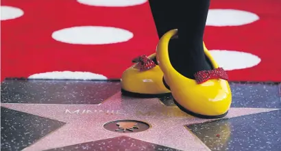  ?? Picture: Reuters ?? AT LAST. The character of Minnie Mouse poses on her star after it was unveiled on the Hollywood Walk of Fame in Los Angeles, United States, on Monday.