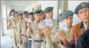  ?? PTI ?? Tripura state rifles force personnel show their ID cards ahead of postal ballot voting in Tripura on Saturday.