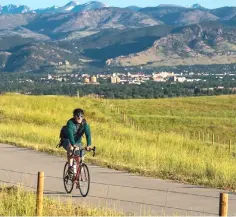  ??  ?? Cycling down the US 36 Bikeway, an 18-mile stretch that links the Colorado cities of Boulder and Westminste­r.