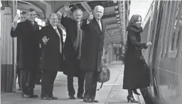  ?? WILLIAM BRETZGER/USA TODAY NETWORK ?? Delaware Gov. John Carney, from left, Sens. Chris Coons and Tom Carper, President Joe Biden and Rep. Lisa Blunt Rochester board a train bound for Wilmington, Del., after inaugurati­on events Jan. 20.