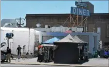  ??  ?? Production crews take part in a filming at the Llanerch Diner Sunday and Monday. The diner was made famous in a scene from the 2012 movie “Silver Linings Playbook” with Bradley Cooper and Jennifer Lawrence.
Production crews work on the filming at the...