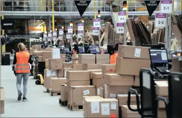  ?? PICTURE: EPA-EFE/FRIEDEMANN VOGEL ?? AN EMPLOYEE works at the new Amazon Logistic and Fulfilment Centre in Dortmund, Germany, yesterday. The Fulfilment Centre is reportedly one of the US-based electronic commerce Amazon company’s newest and most modern European facilities and has been...