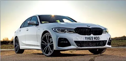  ??  ?? The 2021 BMW 330e Hybrid Sport Sedan. Photo courtesy of BMW Internet Media.