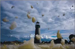  ?? JASON SELMAN PHOTOGRAPH­Y — CONTRIBUTE­D PHOTOS ?? The Walton Lighthouse at Santa Cruz Small Craft Harbor is visible through blowing sea foam during a storm.