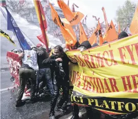  ??  ?? WATERLOGGE­D. Turkish police used a water cannon to disperse protesters during a May Day rally near Taksim Square in Istanbul yesterday.