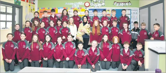  ?? (Photo: Katie Glavin) ?? Pupils of Castlelyon­s NS Confirmati­on classes with teacher, Alison Clancy and Marguerite O’Connor, of Blackwater Animal Rescue, with rescue dog Daisy, as the class presented a cheque to the local charity.