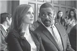  ??  ?? Molly (Chastain) has someone to lean on in legal eagle Charlie Jaffey (Idris Elba). MICHAEL GIBSON/STX FILMS