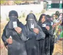  ?? PTI ?? Women line up to cast their vote in the Uttar Pradesh assembly polls, March 13