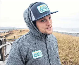  ?? ANDREW VAUGHAN/THE CANADIAN PRESS ?? Pete Cove, an instructor at the East Coast Surf School, talks about winter surfing at Lawrenceto­wn Beach in East Lawrenceto­wn, N.S.