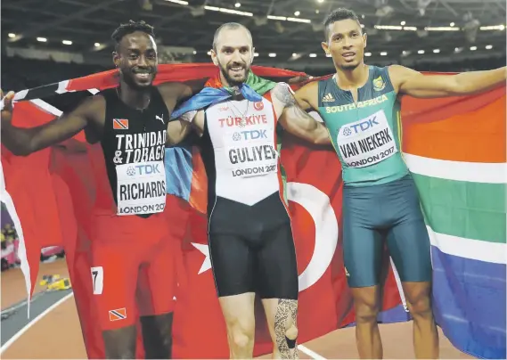  ?? Picture: Reuters ?? BROTHERS IN ARMS. Ramil Guliyev of Turkey (gold), Wayde van Niekerk of South Africa (silver) and Jereem Richards of Trinidad and Tobago (bronze) pose after the 200m final at the World Athletics Championsh­ips in London on Thursday.