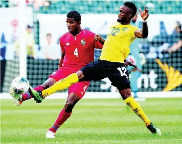  ??  ?? Panama’s Fidel Escobar (left) and Jamaica’s Junior Flemmings battle for the ball during the first half of a Concacaf Gold Cup match on June 30, 2019.