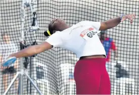  ?? KENYON HEMANS ?? Cedricka Williams wins the under-20 female discus throw at the National Junior Championsh­ips with a national record of 56.21m at the National Stadium yesterday.