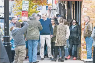  ?? MICHAEL MCANDREWS | SPECIAL TO THE COURANT ?? REPUBLICAN Bob Stefanowsk­i visited shops and met people in the Little Poland section of New Britain on Saturday afternoon.