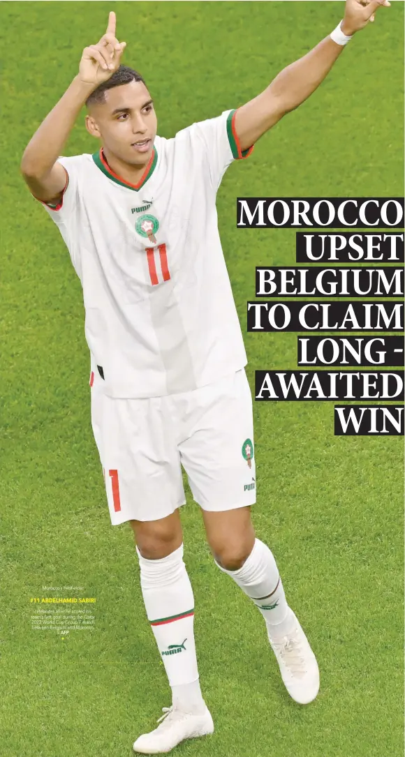  ?? ?? Morocco’s midfielder #11 ABDELHAMID SABIRI celebrates after he scored his team’s first goal during the Qatar 2022 World Cup Group F match between Belgium and Morocco.