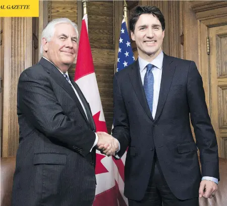  ?? ADRIAN WYLD/AFP/GETTY IMAGES ?? U.S. Secretary of State Rex Tillerson and Prime Minister Justin Trudeau meet on Parliament Hill Tuesday. Canada and the U.S. announced that they will host a summit of foreign ministers in Vancouver in mid-January to seek progress on the North Korean...
