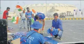  ?? DEEPAK GUPTA/HT ?? Virat Kohli and MS Dhoni’s Tshirt being sold in front of Ekana Stadium ahead of IndiaWest Indies T20 match.