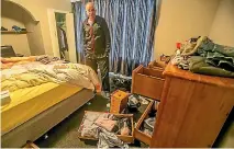  ?? PHOTO: JOHN KIRK-ANDERSON/FAIRFAX NZ ?? Matt Mill in a ransacked room in his house following a burglary during the November tsunami evacuation.