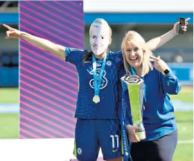  ?? ?? Let’s party: Erin Cuthbert (far left) and Millie Bright lead the Chelsea trophy celebratio­ns; (above) Guro Reiten wears an Emma Hayes mask as she jokes with her manager; (from left, right) Cuthbert and Bright savour the moment with Sam Kerr and Reiten