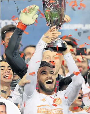  ??  ?? Atlanta United celebrate with the Easter Conference trophy after seeing off New York Red Bulls