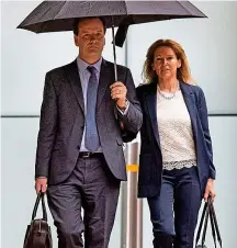  ?? LNP ?? United front: Charlie Elphicke arrives at court with wife Natalie, who replaced him as Tory MP for Dover, yesterday