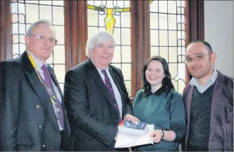  ?? ?? 2013: Sally Chute received her award from Jerry Toner of Heriot Watt University. Left is Chris Mordey, president of the Rotary Club of Campbeltow­n, and right is Campbeltow­n Grammar French teacher Julien Dessans.