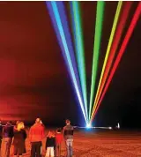  ??  ?? How far can the beams shine? A laser light show on a beach