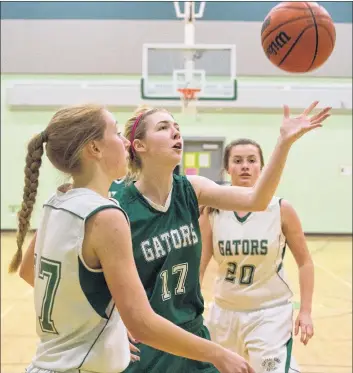  ?? MARK GOUDGE-SALTWIRE NETWORK ?? Alumni Gator Maeghan Maclean (17) grabs for the ball during the Central Kings Gators and Alumni Gators game help at CK recently.