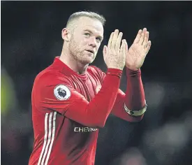  ??  ?? Wayne Rooney applauds the fans following a Premier League match.