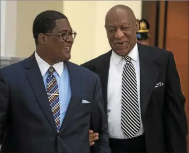  ?? ASSOCIATED PRESS ?? Bill Cosby is escorted into Montgomery County Courtroom A in Norristown for a pretrail hearing Monday.