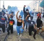  ?? Michel Euler Associated Press ?? PARISIANS take to the streets in June 2020 to demonstrat­e against police violence and racial injustice.