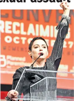  ??  ?? McGowan speaks on stage at The Women’s Convention at Cobo Centre on Friday in Detroit, Michigan. (Below) McGowan addresses the audience during a panel discussion on ‘Survivors of Sexual Assault in the Age of Betsy Devos’ during the convention. —...