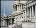  ??  ?? In this file photo, dark clouds and heavy rain sweep over the US Capitol in Washington. (AP)