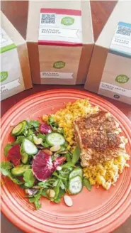  ??  ?? HelloFresh is dedicated to using sustainabl­y farmed fish in dishes such as its Turkish-Spiced Salmon served with Arugula-Blood Orange Salad and Couscous Pilaf.