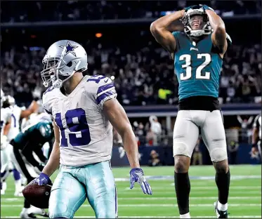  ?? AP/ROGER STEINMAN ?? Dallas wide receiver Amari Cooper scores in overtime as Rasul Douglas of the Philadelph­ia Eagles watches, giving the Cowboys a 29-23 victory Sunday in Arlington, Texas. Cooper finished with 10 catches for 217 yards and 3 touchdowns in his second game in the past three with at least 180 yards and 2 scores.