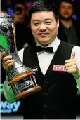  ?? GETTY IMAGES ?? Champ: Ding Junhui shows off the trophy